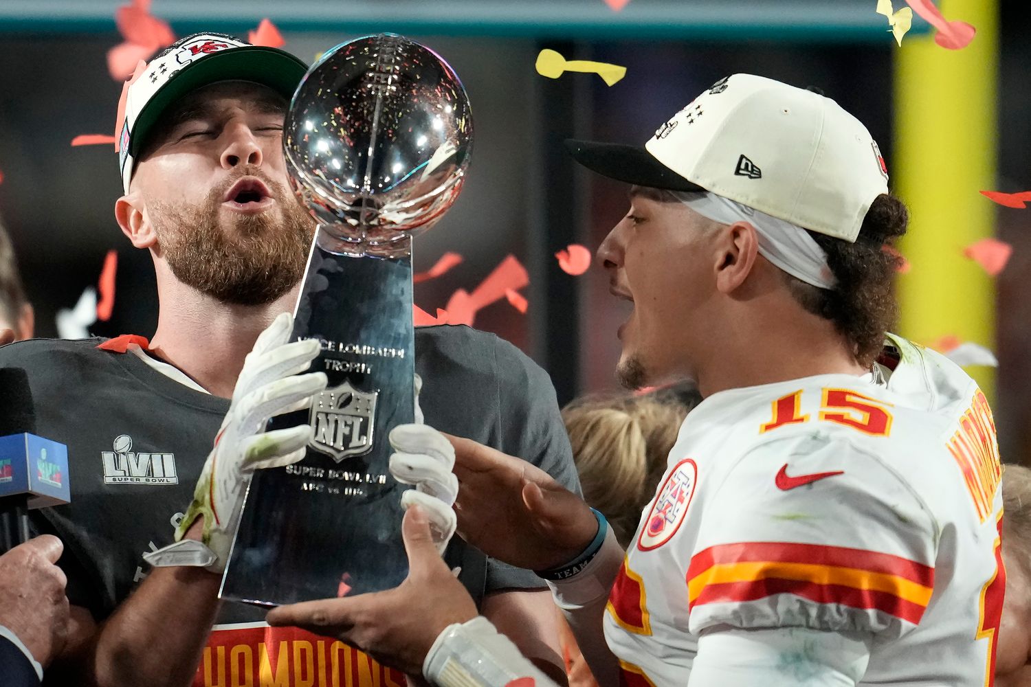 Kansas City Chiefs tight end Travis Kelce, left, and quarterback Patrick Mahomes (15) holds the Vince Lombardi Trophy after the NFL Super Bowl 57 football game against the Philadelphia Eagles, Sunday, Feb. 12, 2023, in Glendale, Ariz. The Kansas City Chiefs defeated the Philadelphia Eagles 38-35.